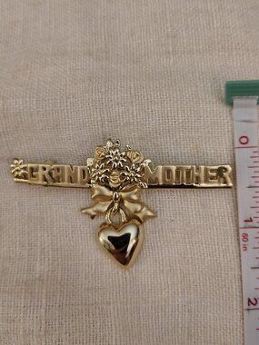 AJC: Grandmother Gold tone Brooch